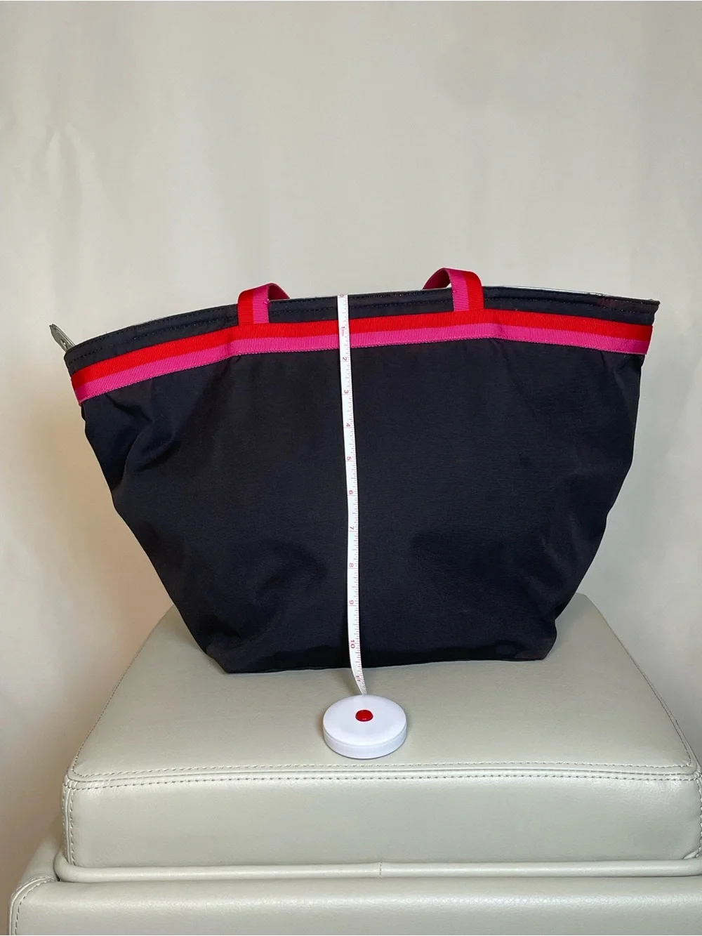 kate spade black tote with pink and red trim